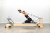 Enjoy Pilates Physio on a Full Slide Track Small White Bed