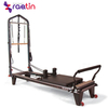 Pilates exercise equipment elevated Cadillac bed