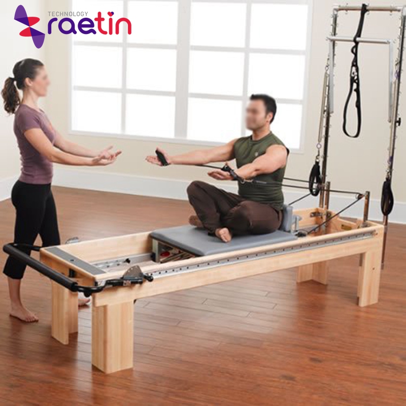 Pilates exercise equipment elevated Cadillac bed
